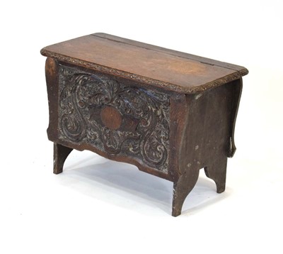 Lot 43 - An oak hutch, the front panel with carved...