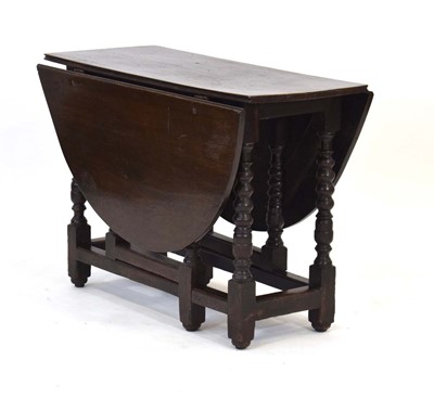 Lot 46 - A 17th century and later oak gateleg dining...