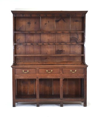 Lot 50 - An 18th century oak dresser, the three-tier...