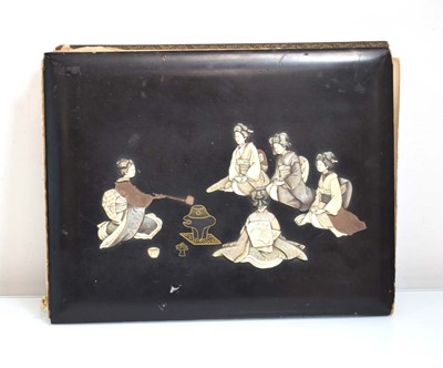 Lot 324 - A Japanese black lacquered album relief...