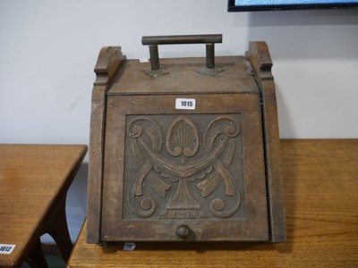 Lot 1015 - Dark oak coal scuttle with carved doorfront