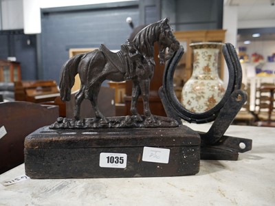 Lot 1035 - Cast metal door stop in the form of a horse...