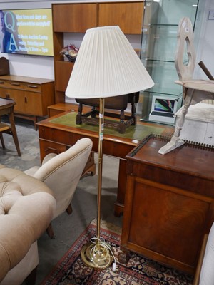 Lot 1043 - Brass finish floor lamp with ruffled cream shade