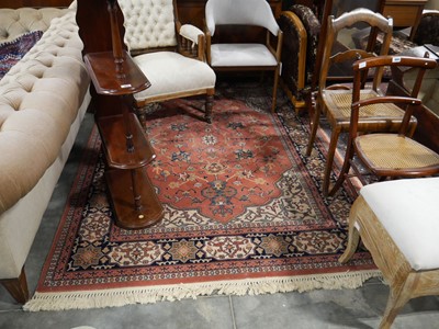 Lot 1047 - Pink, blue and beige figured and bordered rug