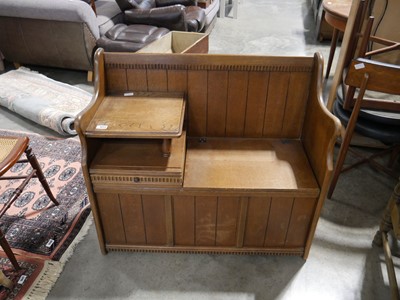 Lot 1051 - Dark oak telephone table with seat storage