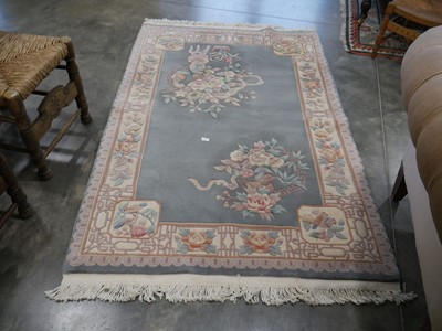 Lot 1053 - Green, beige and pink Oriental themed, figured...