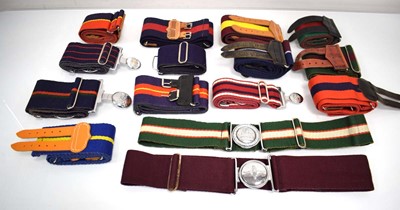 Lot 122 - A group of fifteen military belts, some with...