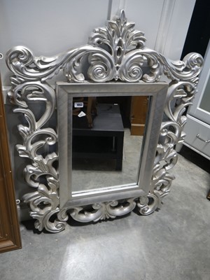 Lot 1063 - Large ornate silver coloured wall mirror