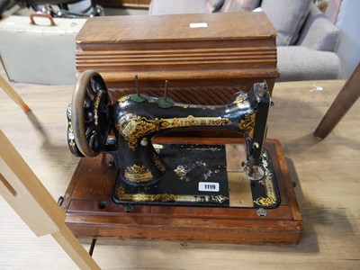 Lot 1119 - Manual operated Singer sewing machine in...