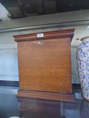 Lot 302 - A desktop writing cabinet, the pull down flap...