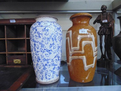 Lot 303 - A blue and white vase with floral decoration...