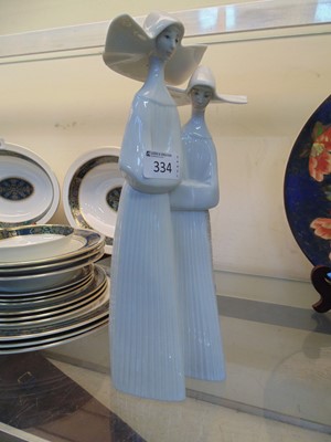 Lot 334 - A Lladro ceramic figural group of two nuns