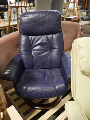 Lot 1129 - Navy upholstered swivel easy chair