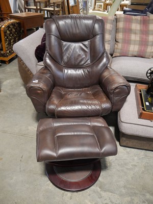 Lot 1136 - Modern brown leather upholstered swivel easy...