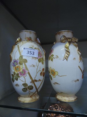 Lot 353 - A pair of white ground ceramic vases by Royal...