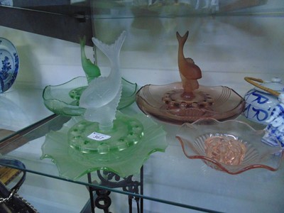 Lot 367 - Two green glass table centre displays...