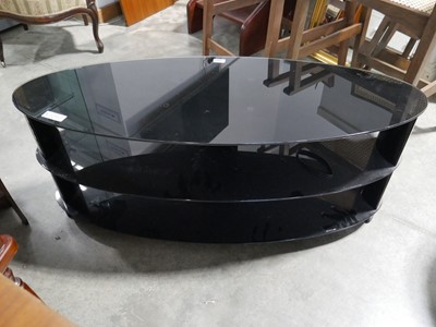 Lot 1143 - Oval 3 tier black glass TV stand