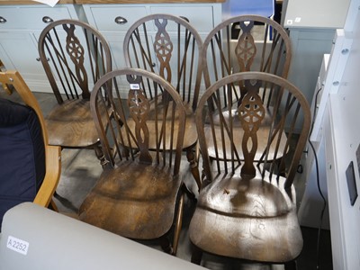 Lot 1153 - Set of 5 dark oak wheel back dining chairs