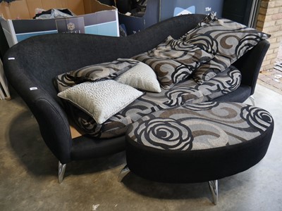 Lot 1167 - Stylized black upholstered sofa with patterned...