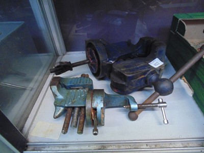 Lot 402 - A bench vice together with one other