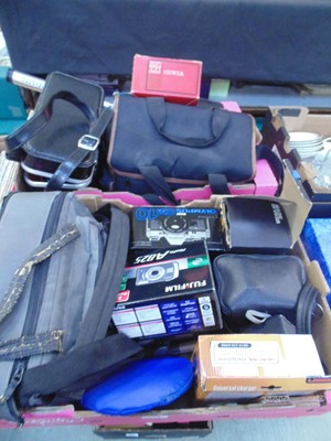 Lot 524 - Two trays of assorted cameras, tripods, etc to...