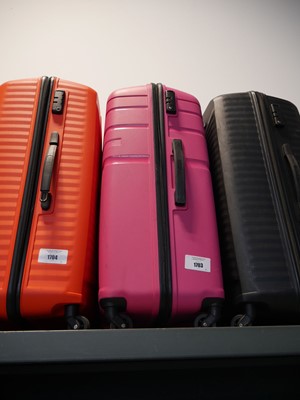 Lot 1703 - Large American Tourister suitcases in pink