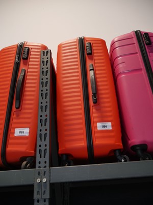 Lot 1704 - Large American Tourister suitcases in orange