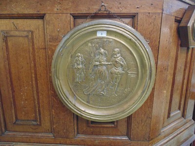 Lot 8 - An embossed brass plaque depicting Victorian...