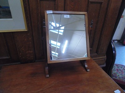 Lot 14 - A mahogany framed swing toilet mirror