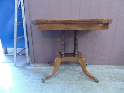 Lot 17 - A 19th century mahogany fold over games table