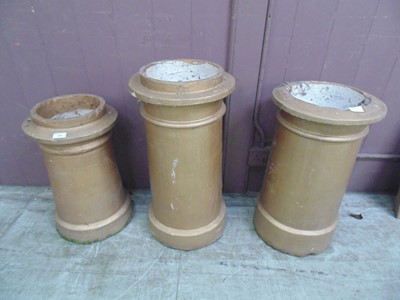 Lot 19 - Three gold painted garden chimney pots