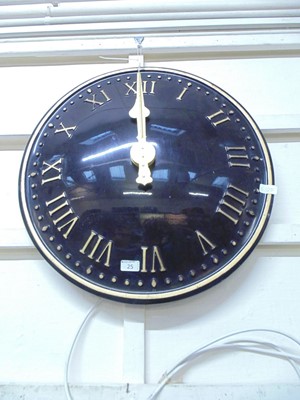 Lot 25 - A large black and gilt electric wall clock