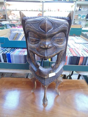 Lot 51 - An African carved mask