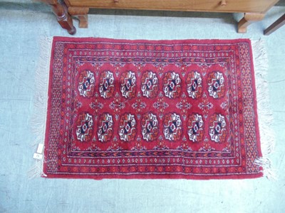 Lot 52 - A small rectangular red ground eastern rug