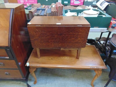 Lot 57 - A small mid-20th century oak gate leg table...