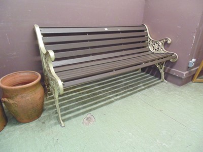 Lot 64 - A wood and metalwork garden bench