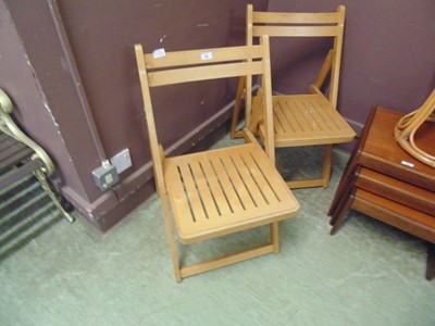 Lot 65 - A pair of mid-20th century folding slatted chairs