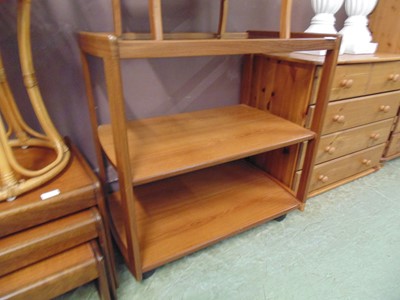 Lot 69 - A mid-20th century teak three tier tea trolley...