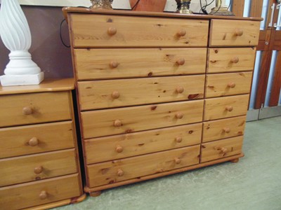 Lot 75 - A modern pine bank of six long drawers and six...