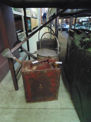 Lot 87 - A red petrol can together with two galvanised...