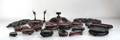 Lot 316 - A group of Oriental carved wooden stands (qty)