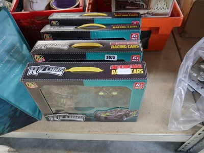 Lot 3073 - 4 boxed RC toy racing cars