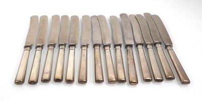 Lot 479 - Fourteen German silver handled table knives,...