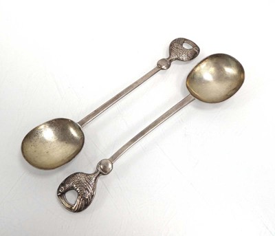 Lot 481 - A pair of hammered metalware spoons, each with...