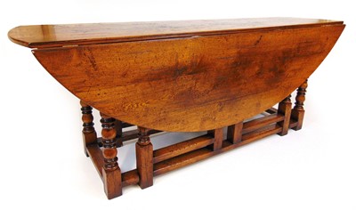 Lot 16 - In the 18th century style, an oak 'wake' table,...