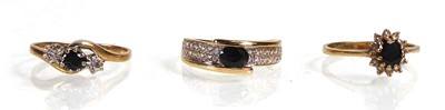 Lot A 9ct yellow gold cluster ring set dark oval...