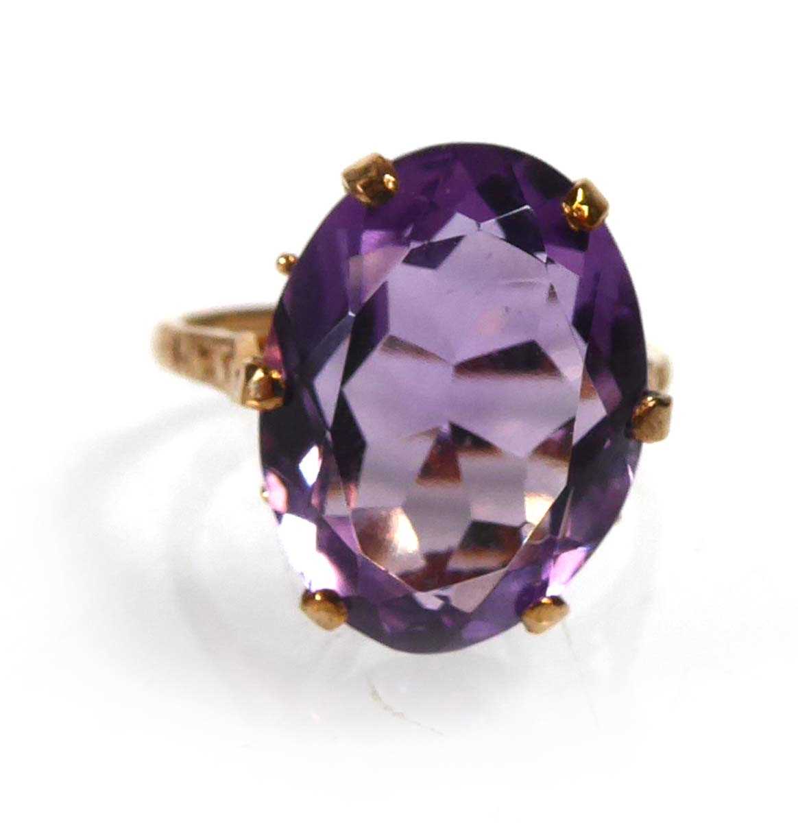 Lot A 9ct yellow gold ring set oval amethyst in a...