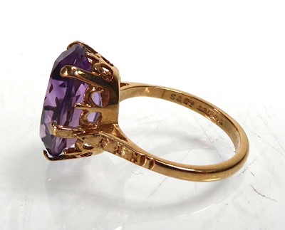 Lot A 9ct yellow gold ring set oval amethyst in a...