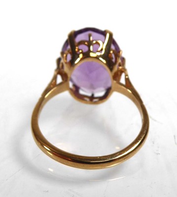 Lot A 9ct yellow gold ring set oval amethyst in a...