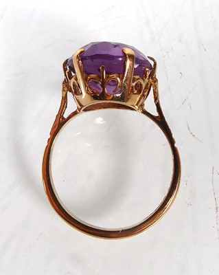 Lot A 9ct yellow gold ring set oval amethyst in a...